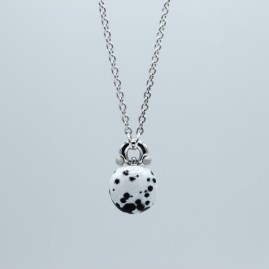 Handmade silver and copper hot enamel necklace with Dalmatian motif .