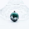 Les Petits Mondes Green Forest Pendant: domed circular design with intricate silver wire outlines.